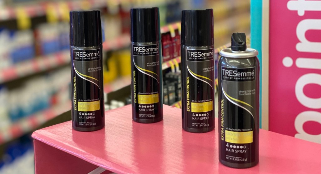 4 bottles of tresemme hair spray on display in store