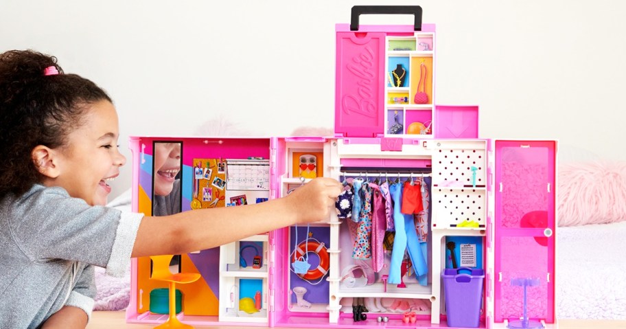 girl playing with a Barbie Dream Closet