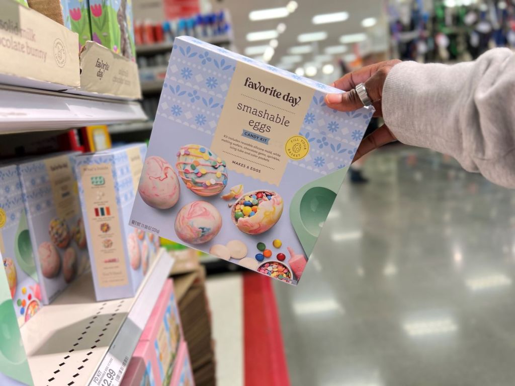 Hand holding a Favorite Day Easter Smashable Egg DIY Kit