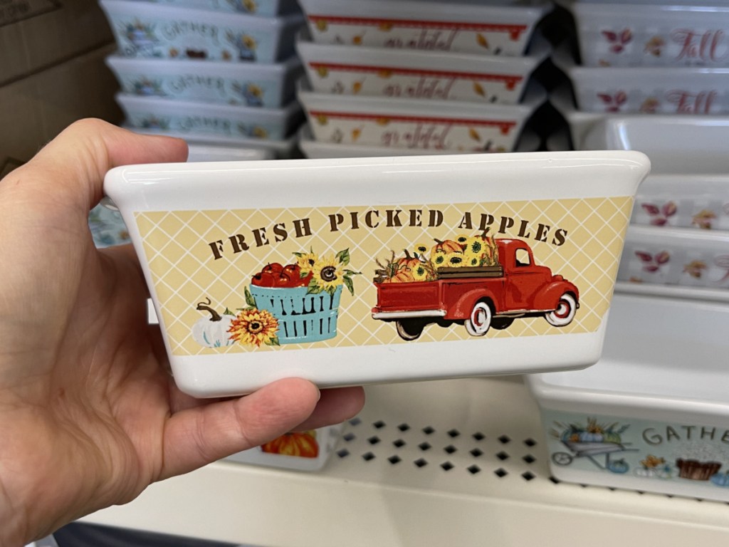 hand holding fall-themed loaf pan in store