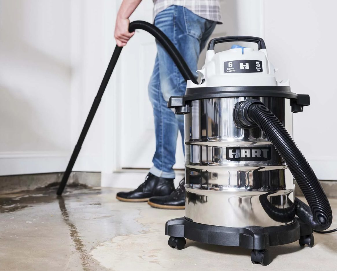 Person using Hart Wet/Dry Vacuum on wet floor