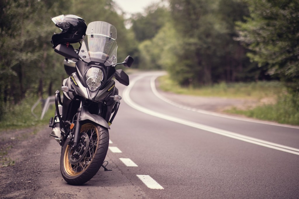 a motorcycle parked on the side of the road 