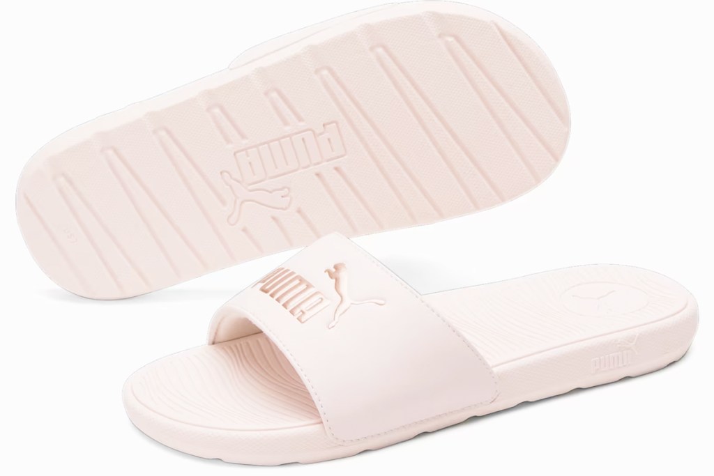 pair of light pink puma slides