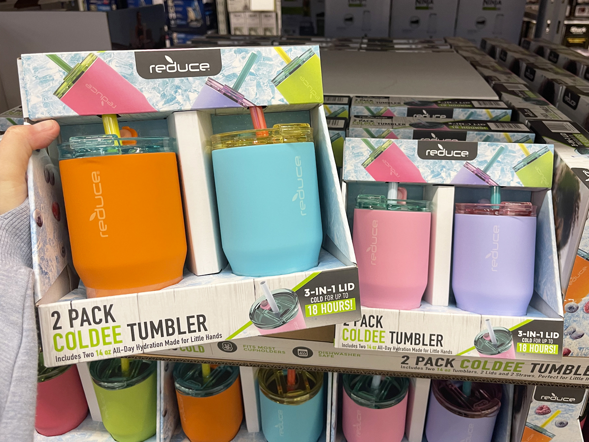 hand holding set of kids tumblers