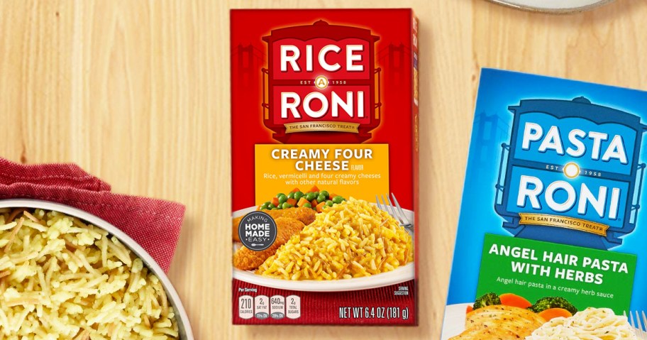 pot of rice-a-roni next to boxes of rice-a-roni and pasta-roni