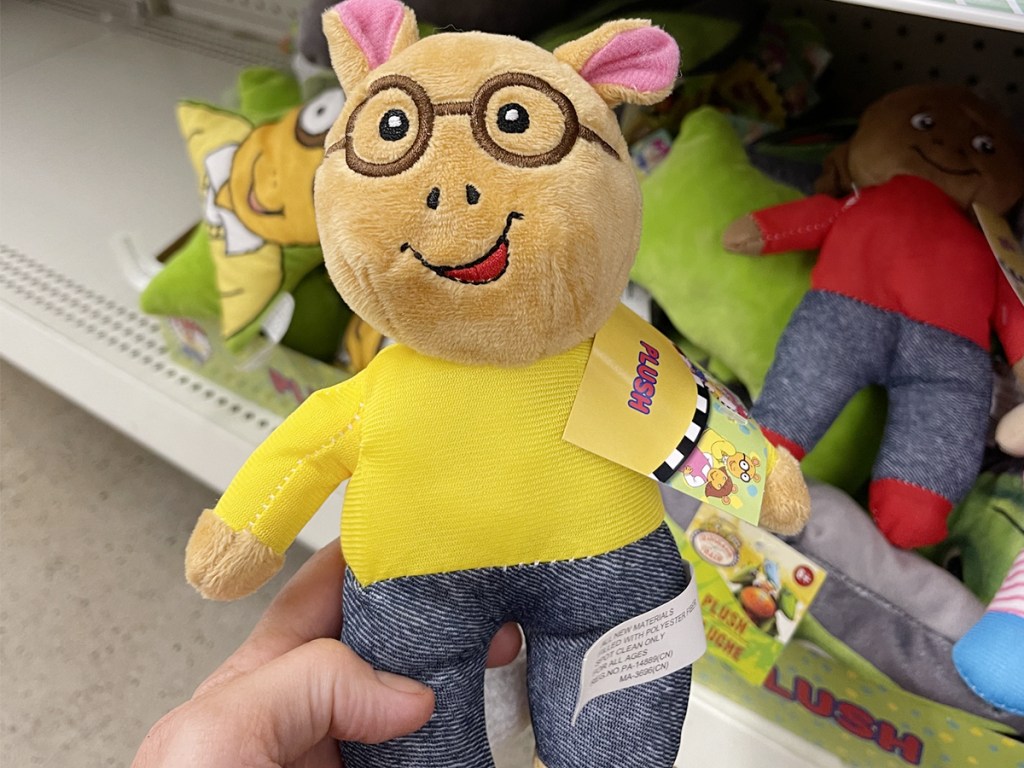 hand holding arthur plush in store