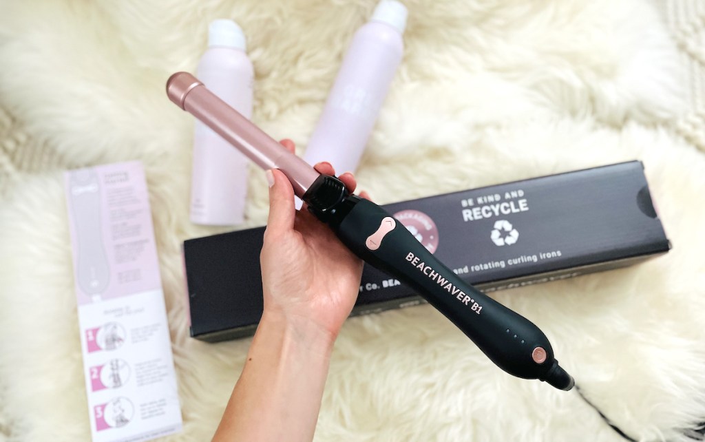 hand holding beachwaver curling wand