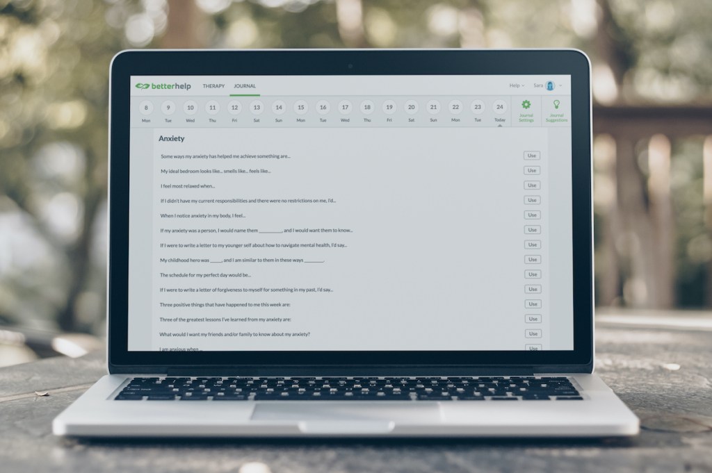 laptop with betterhelp promo code therapy journal on screen