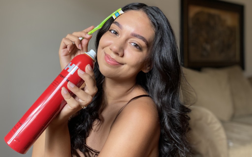 brushing baby hair with toothbrush