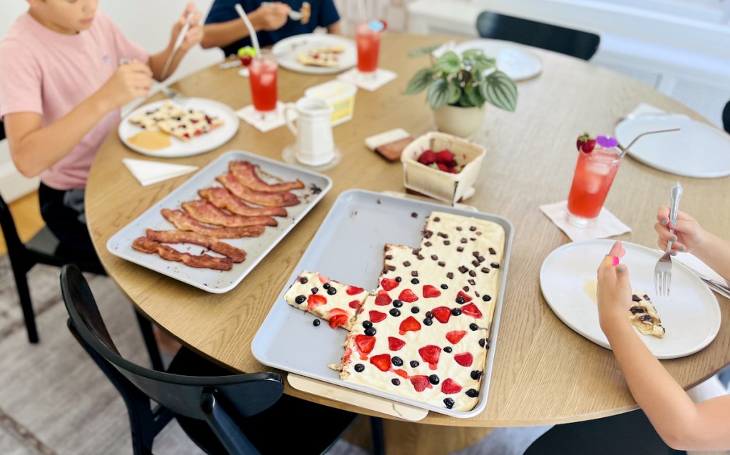 caraway bakeware on table with bacon and sheet pancakes 