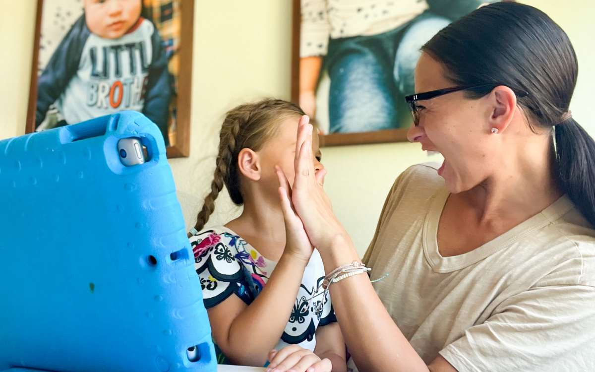 mom & daughter high-fiving