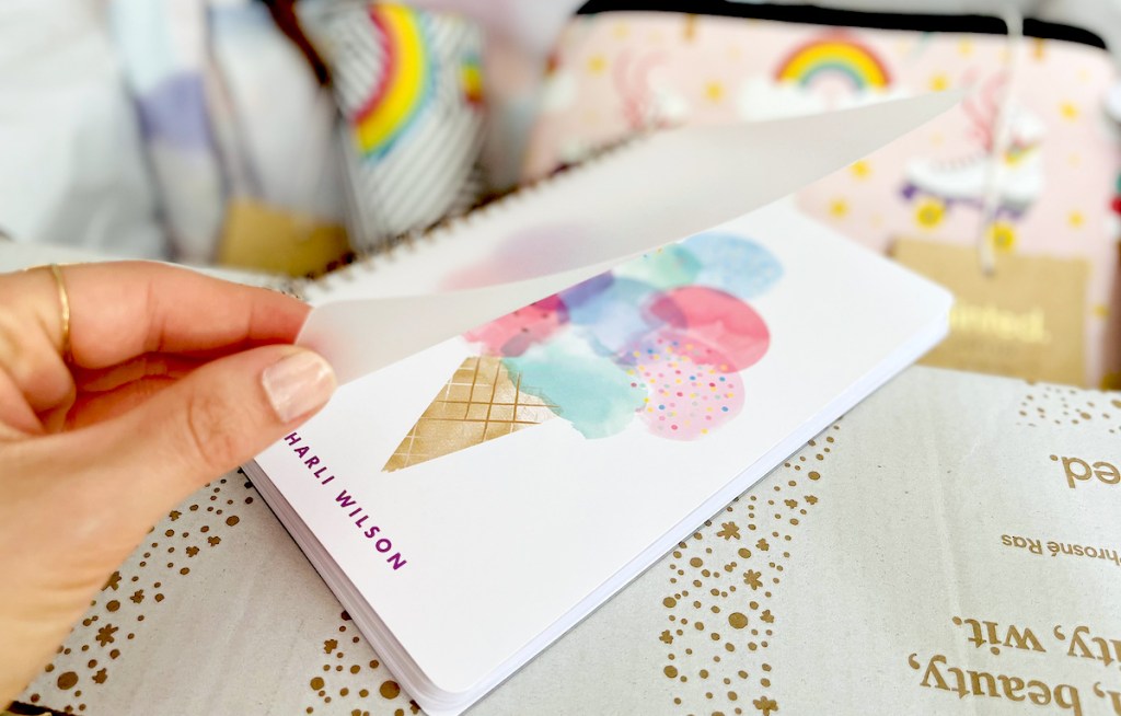 hand holding open ice cream notebook