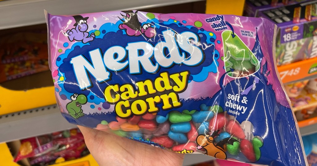 hand holding nerds candy corn 