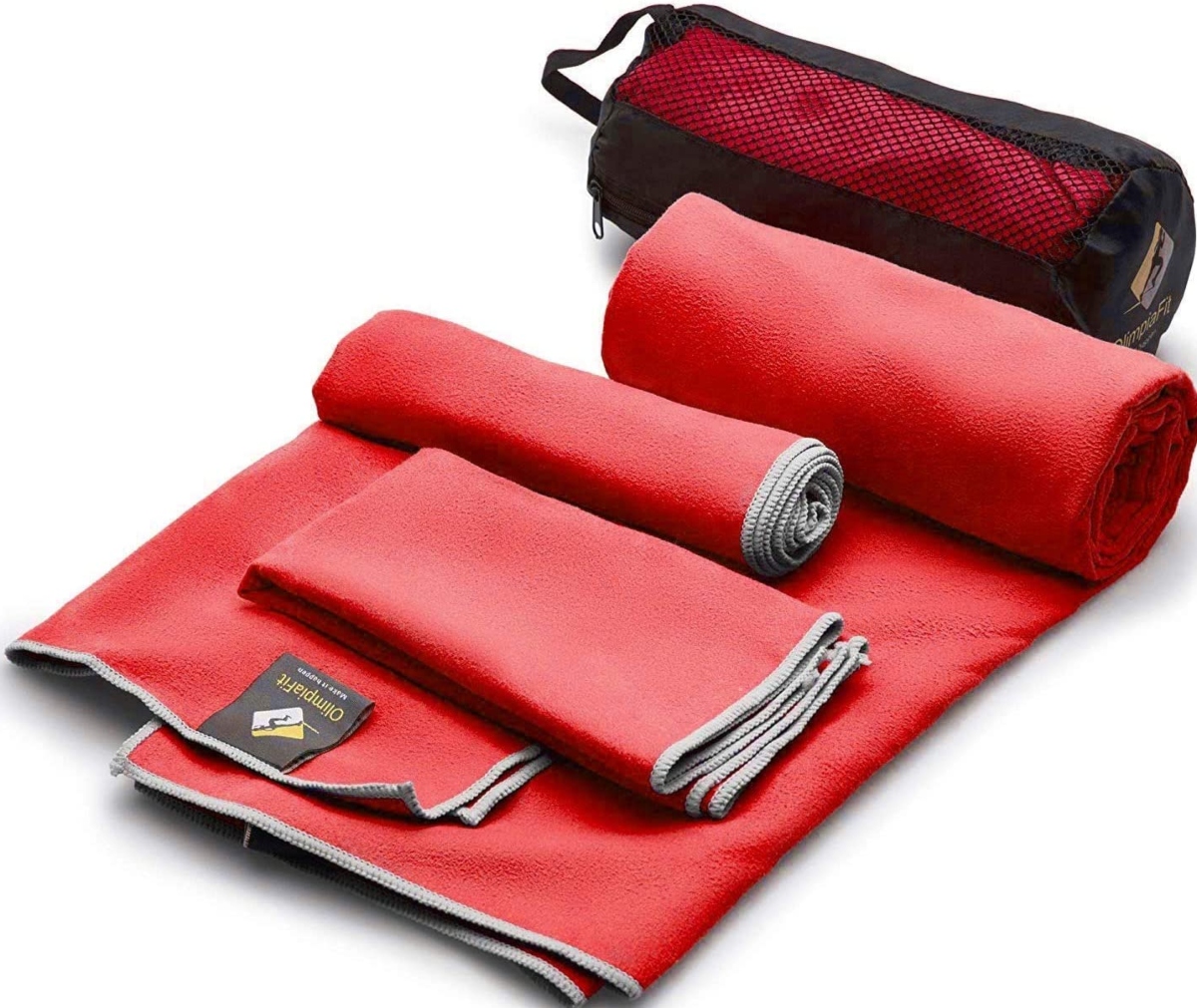 red quick dry towels half rolled up with a carrying case