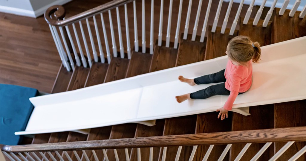 girl on stairslide on stairs