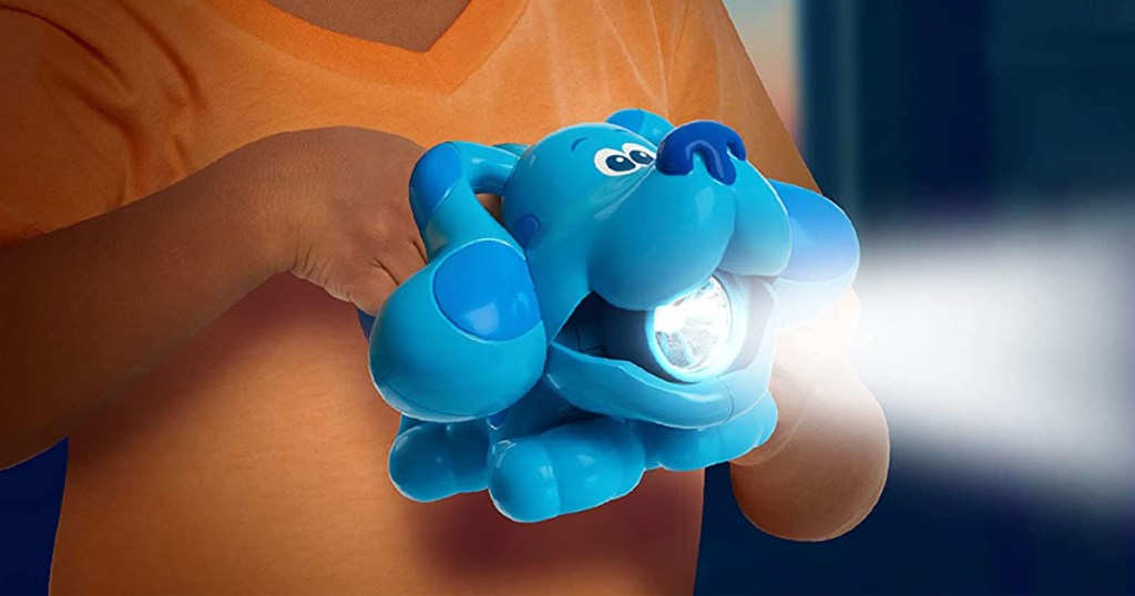 kid holding blues clues flashlight