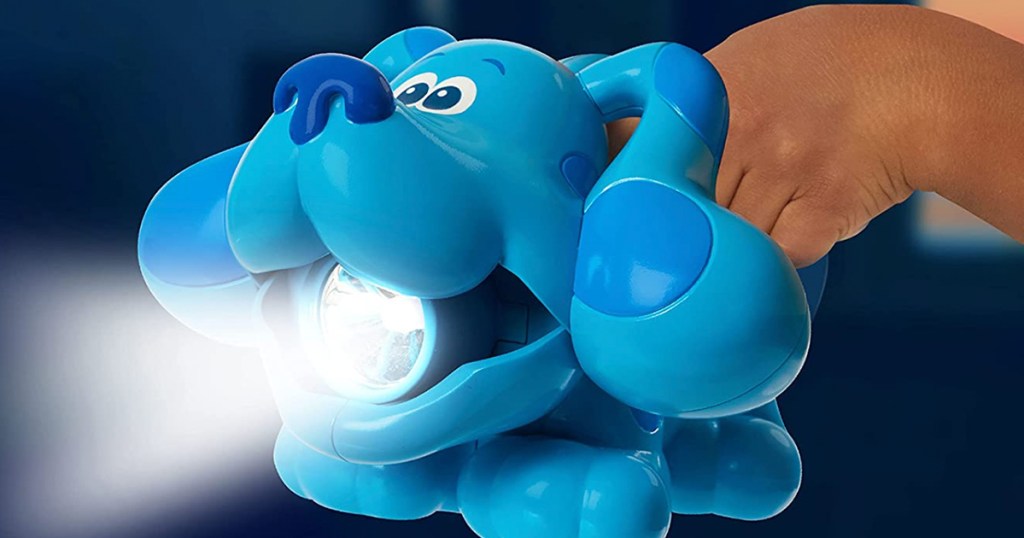 kid holding blues clues flashlight