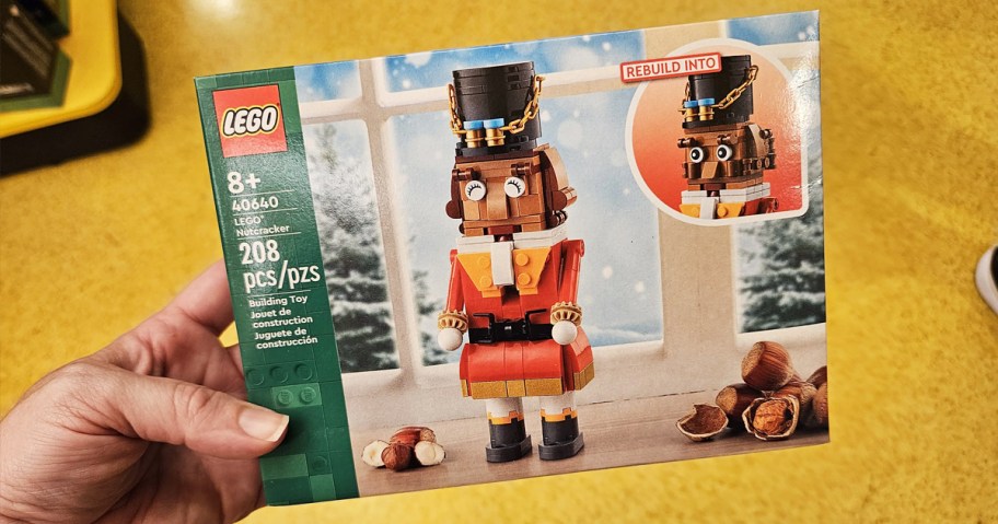 hand holding up LEGO Nutcracker box in store