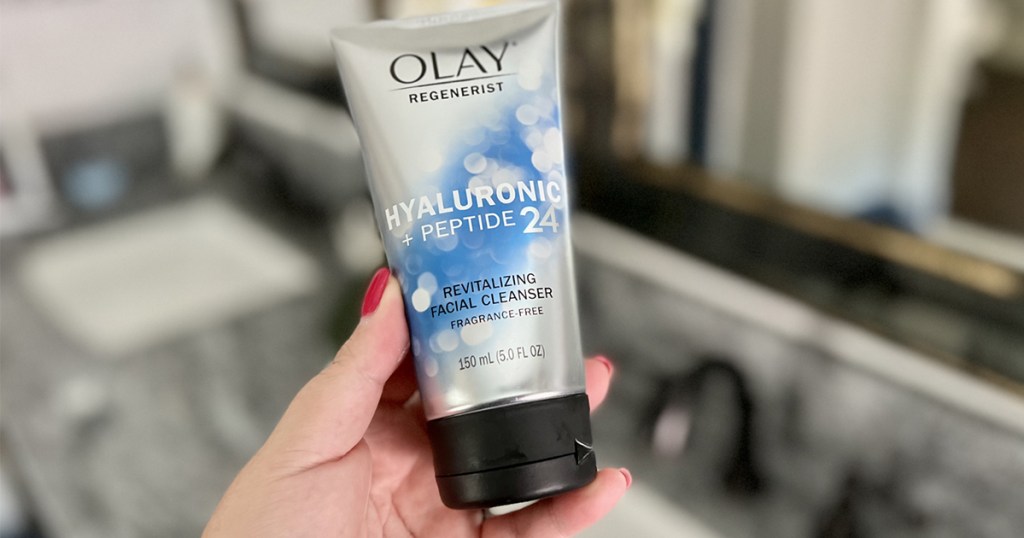 olay facial cleanser in hand