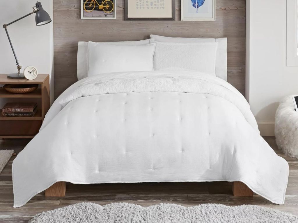 white onlineforter on bed