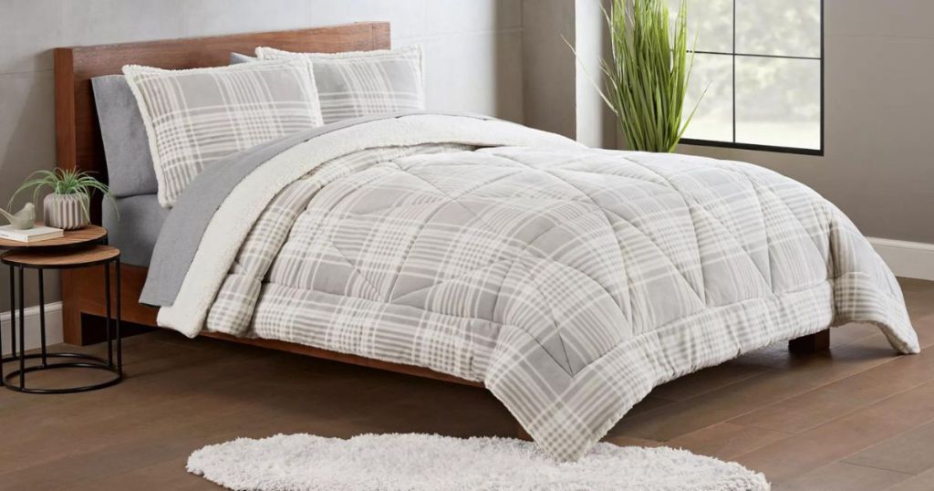 gray and white plaid onlineforter on bed