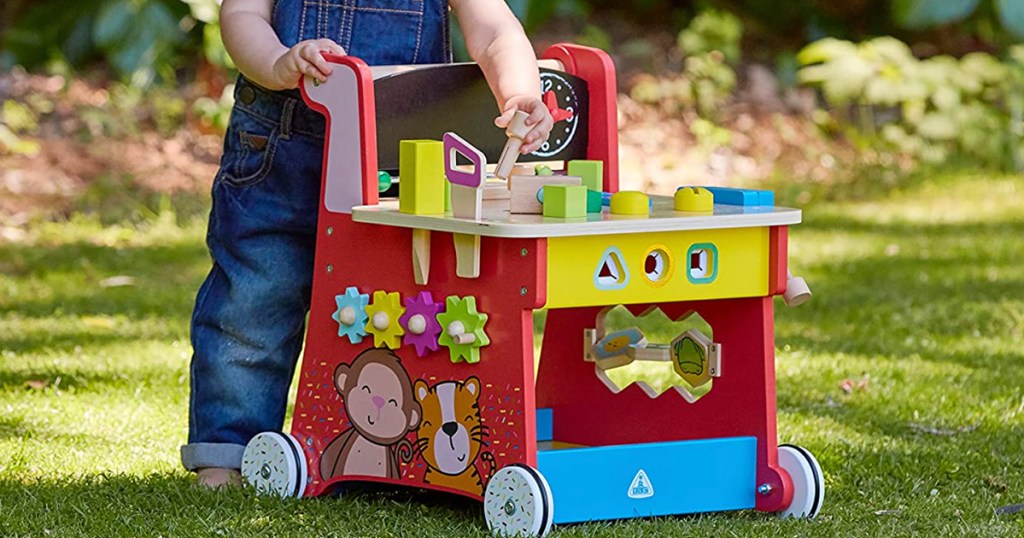 boy playing with early learning center toy