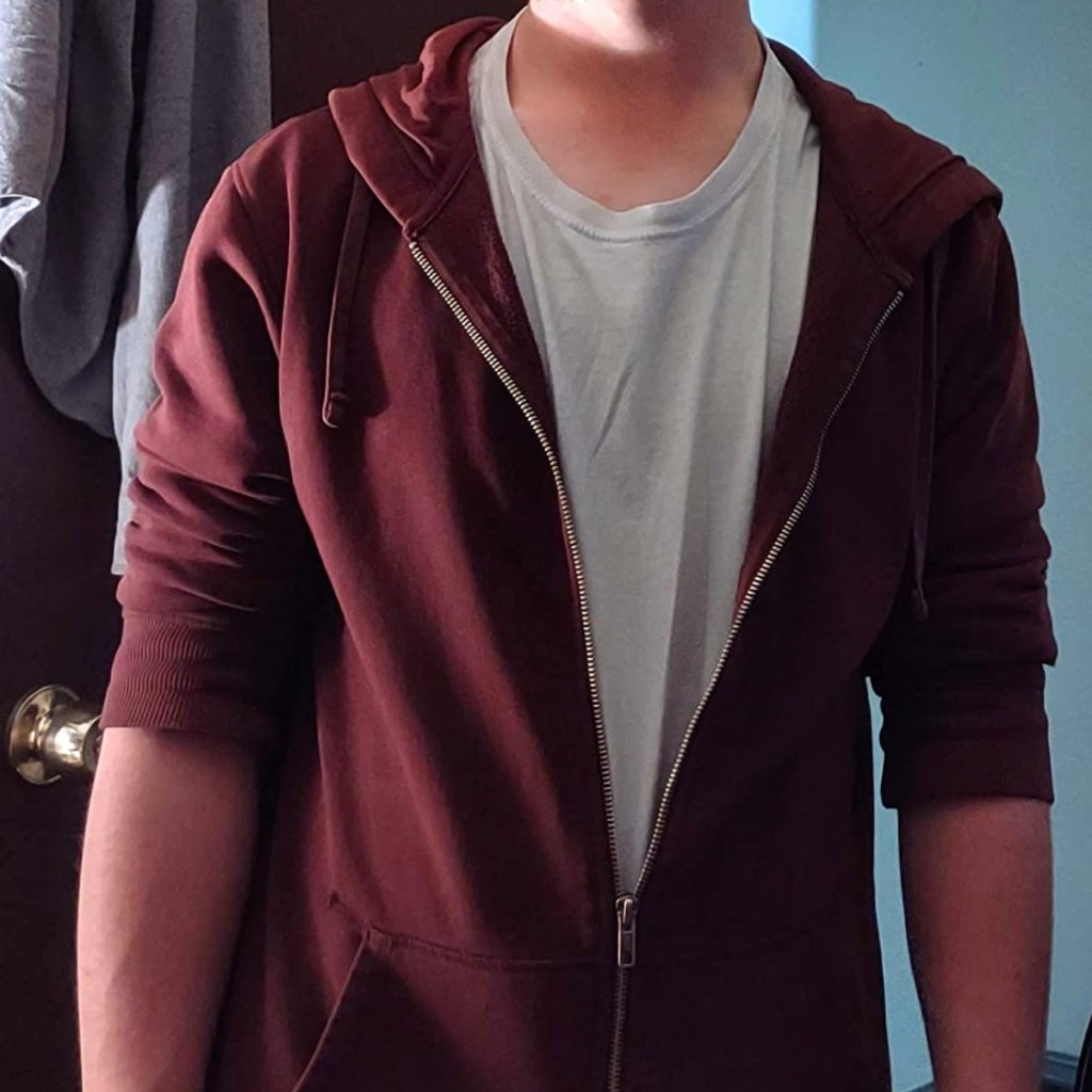 man wearing maroon hoodie