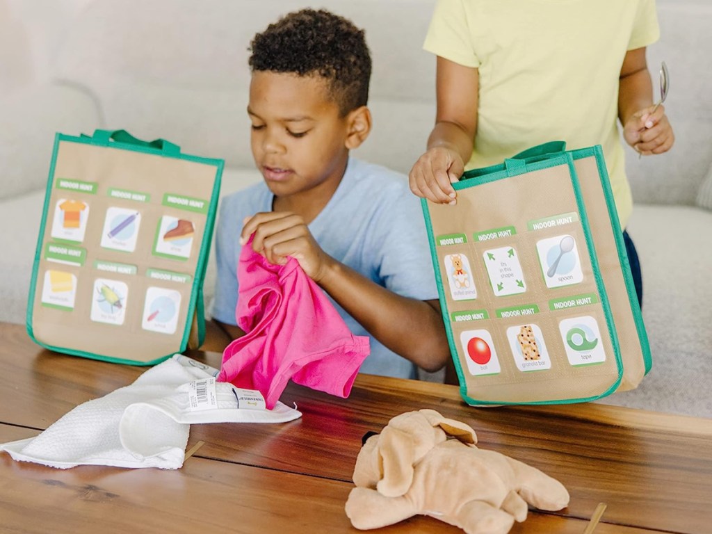 kids playing with explore bags from Melissa and doug