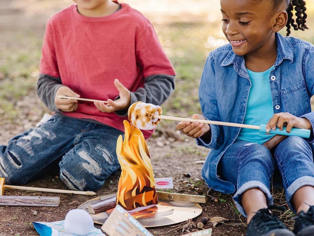 kids playing with more explore Melissa & Doug game