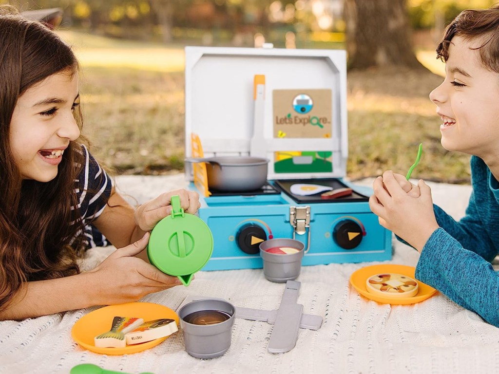 kids playing with outdoor bbq kit