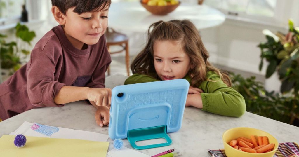 kids looking at a Amazon Fire Kids Tablet