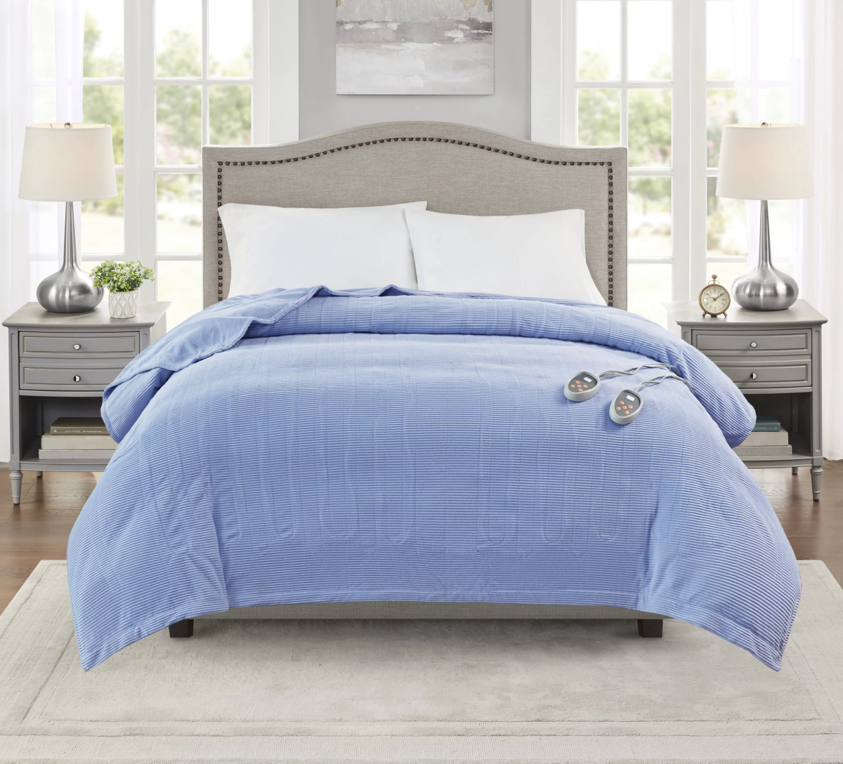 A blue blanket draped over a bed