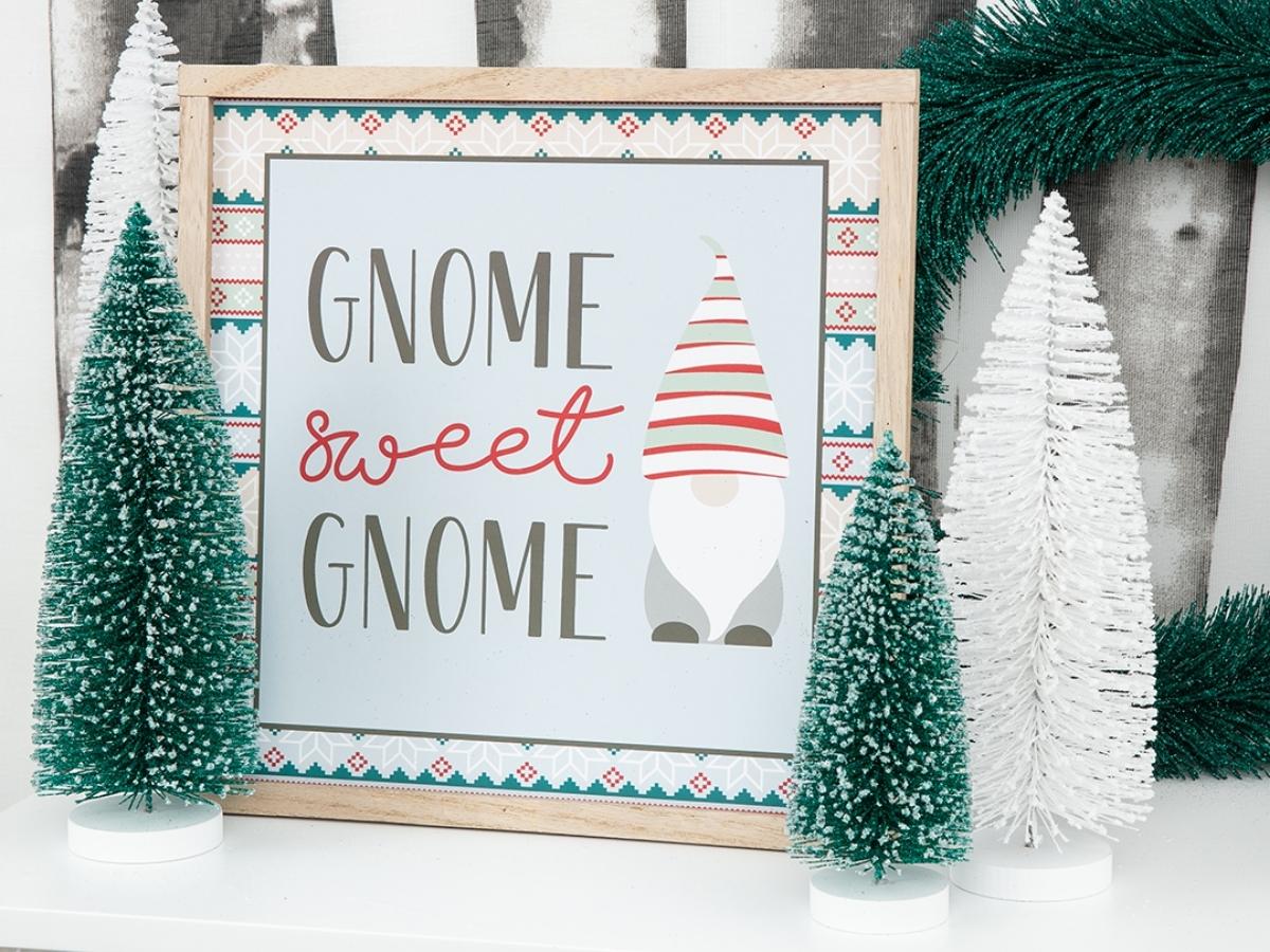 Five Below Gnome Wooden Christmas Sign nestled among bottle brush trees