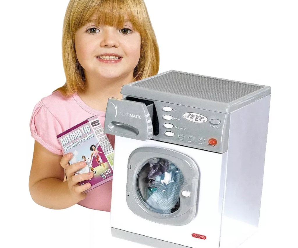 Girl with toy washing machine