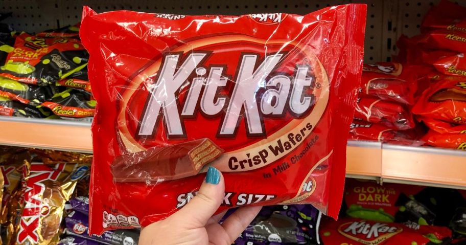 hand holding a Kit Kat Snack Size bag