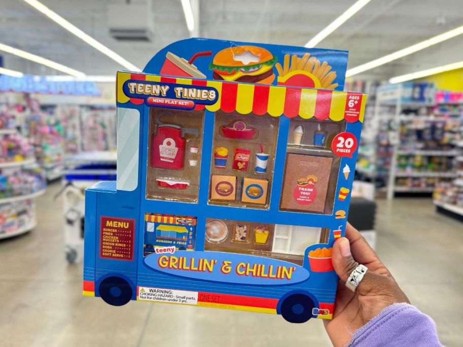 hand holding a Teeny Tinies foodies mini play set in the shape of a Burger Truck 