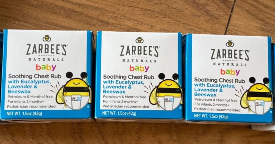 three boxes of Zarbee's Chest Rub on table