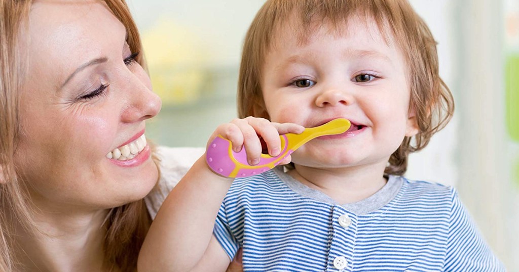 child using toothbrush