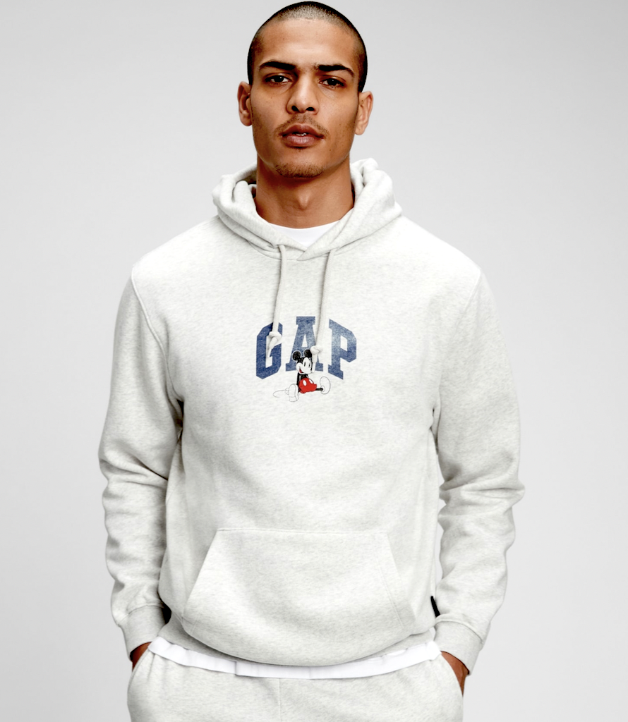 man wearing Gap Disney sweatshirt 