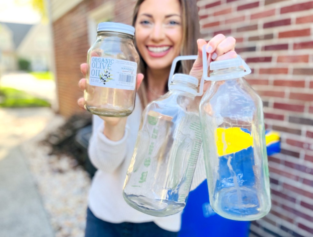 woman holding glass containers