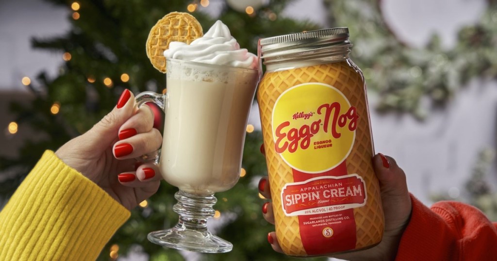 clinking a glass of egg nog with a jar of Eggo Nog 