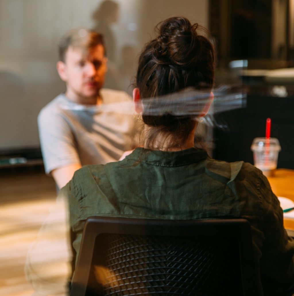 man sitting with teen struggling with mental health