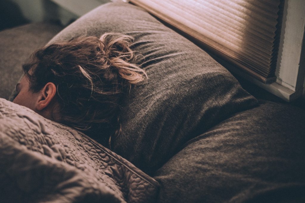 girl sleeping in bed 