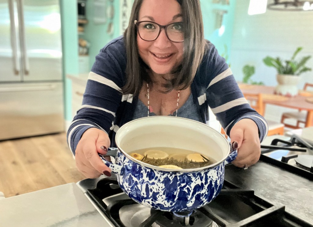 woman holding a batch of stovetop potpourri