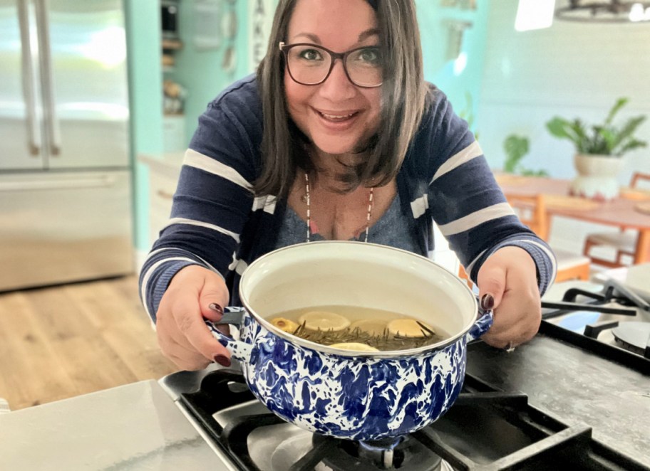 woman holding a batch of stovetop potpourri