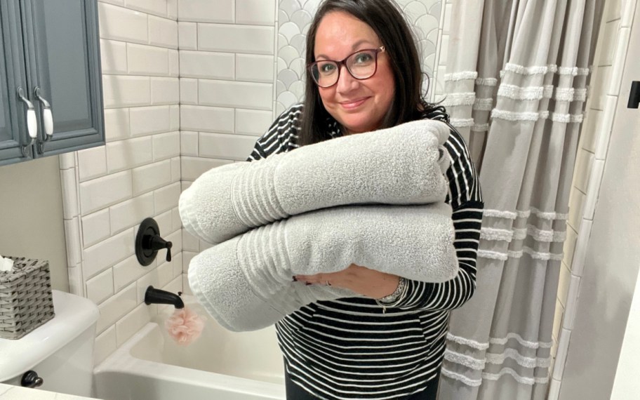 woman holding vera wang towels