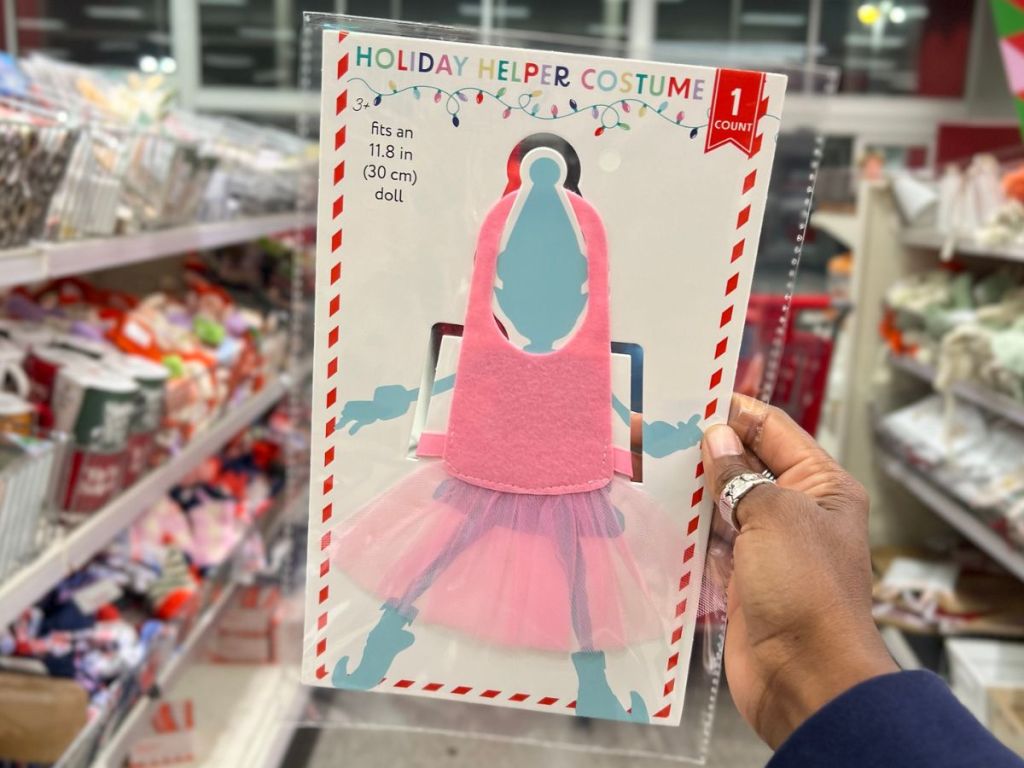 Hand holding up an Elf on the Shelf Costume at Target