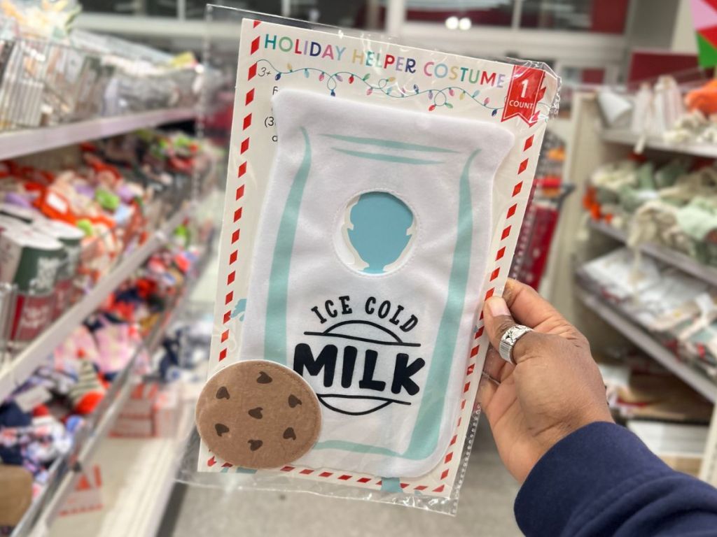 Hand holding up an Elf on the Shelf Costume at Target