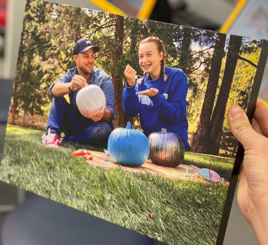 Image of hand holding up a CVS photo canvas print