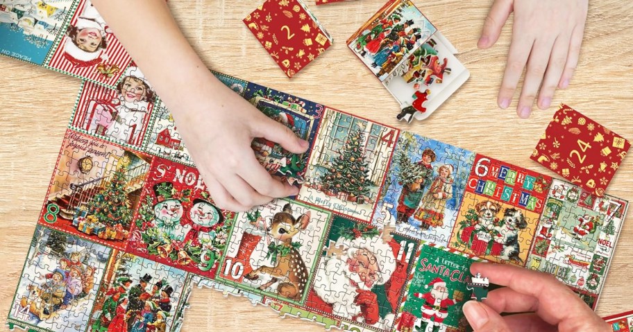 hands onlinepleting christmas countdown puzzle on table